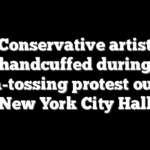 Conservative artist handcuffed during pizza-tossing protest outside New York City Hall