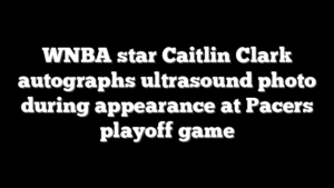 WNBA star Caitlin Clark autographs ultrasound photo during appearance at Pacers playoff game
