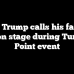 Eric Trump calls his father live on stage during Turning Point event