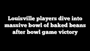 Louisville players dive into massive bowl of baked beans after bowl game victory