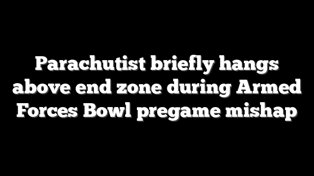 Parachutist briefly hangs above end zone during Armed Forces Bowl pregame mishap