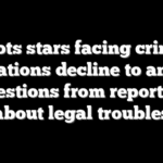 Patriots stars facing criminal allegations decline to answer questions from reporters about legal troubles