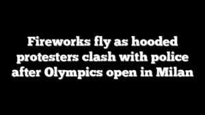 Fireworks fly as hooded protesters clash with police after Olympics open in Milan