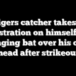 Dodgers catcher takes out frustration on himself by banging bat over his own head after strikeout