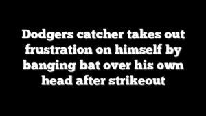 Dodgers catcher takes out frustration on himself by banging bat over his own head after strikeout