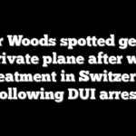 Tiger Woods spotted getting off private plane after weeks of treatment in Switzerland following DUI arrest