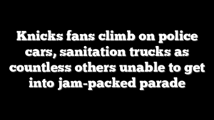 Knicks fans climb on police cars, sanitation trucks as countless others unable to get into jam-packed parade