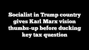 Socialist in Trump country gives Karl Marx vision thumbs-up before ducking key tax question